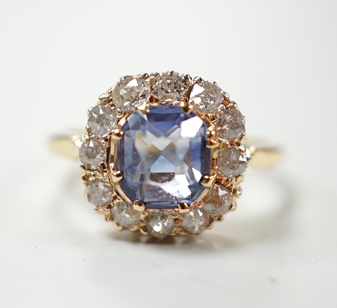 An 18ct, sapphire and diamond set cluster ring, size M, gross weight 3 grams.